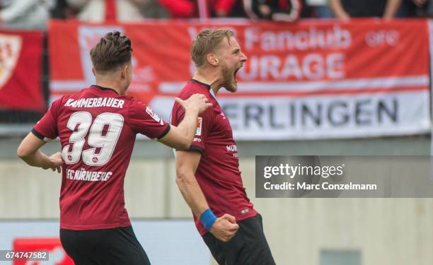Hanno Behrens and Patrick Kammerbauer of Nuernberg celebrate the first goal against Stuttgart during the Second Bundesliga match between 1. FC...