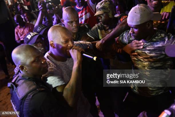 French singer Bedaya N'Garo Singuila aka Singuila sings in the middle of the audience as he performs at the Festival des Musiques Urbaines d'Anoumabo...