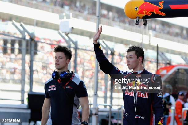 Daniil Kvyat of Russia and Scuderia Toro Rosso waves to the crowd from the pit lane during qualifying for the Formula One Grand Prix of Russia on...
