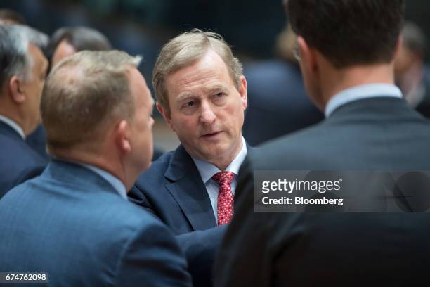 Enda Kenny, Ireland's prime minister, center, talks with Lars Lokke Rasmussen, Denmark's prime minister, left, and Mark Rutte, Dutch prime minister,...