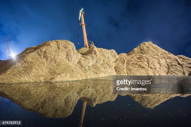 chip mountain - biomass renewable energy source stock pictures, royalty-free photos & images