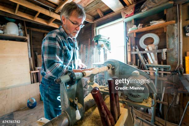 carpenter, woodworker working with electric lathe in his workshop - lathe stock pictures, royalty-free photos & images