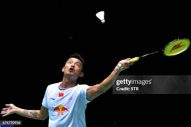 Lin Dan of China hits a return against Lee Chong Wei of Malaysia during their men's singles semi-final match at the 2017 Badminton Asia Championships...