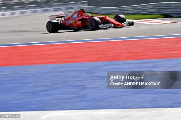 Ferrari's German driver Sebastian Vettel steers his car during the qualifying session for the Formula One Russian Grand Prix at the Sochi Autodrom...