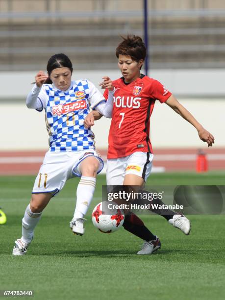 Sawako Yasumoto of Mynavi Vegalta Sendai Ladies and Risa Ikadai of Urawa Red Diamonds Ladies compete for the ball during the Nadeshiko League match...