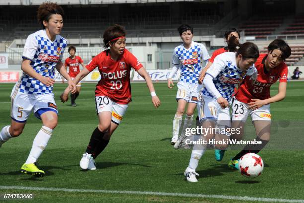 Sawako Yasumoto of Mynavi Vegalta Sendai Ladies and Aoi Kizaki of Urawa Red Diamonds Ladies compete for the ball during the Nadeshiko League match...