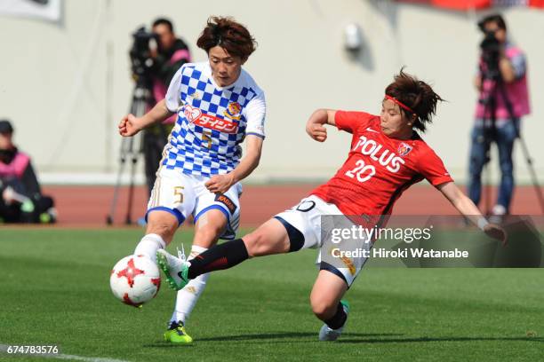 Yuki Sakai of Mynavi Vegalta Sendai Ladies and Chika Kato of Urawa Red Diamonds Ladies compete for the ball during the Nadeshiko League match between...