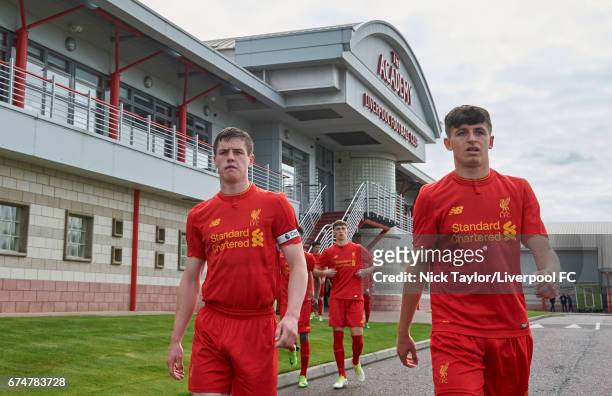 Captain Liam Coyle and Anthony Glennon of Liverpool make their way to the pitch from the main Academy building before the Liverpool v Chelsea U18...