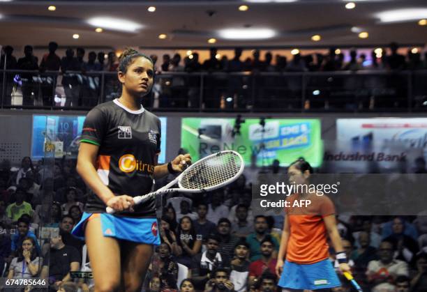 India's Dipika Pallikal celebrates after winning the match against Hong Kong's Annie Au in their women's semifinal match at the 19th Asian Squash...