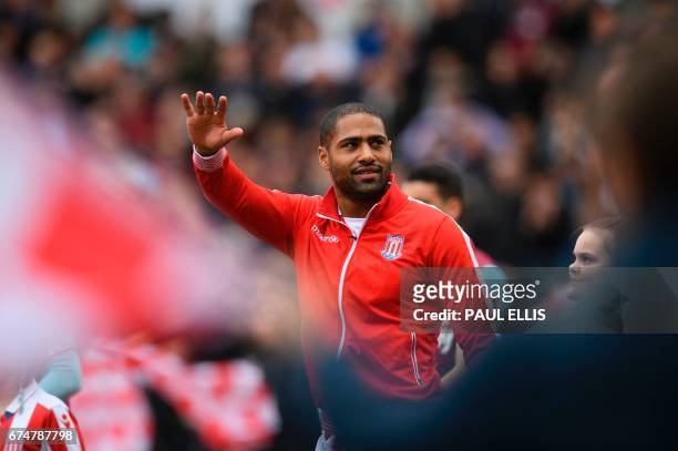 Stoke City's English defender Glen Johnson arrives on the pitch to play the English Premier League football match between Stoke City and West Ham...