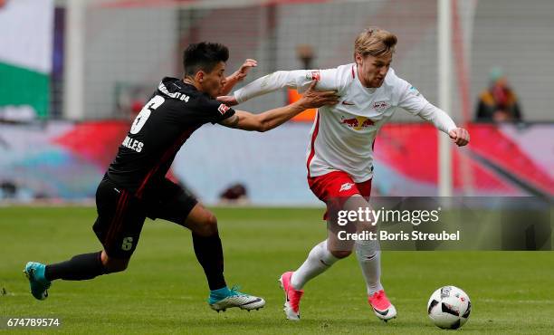Emil Forsberg of RB Leipzig is challenged by Alfredo Morales of FC Ingolstadt 04 during the Bundesliga match between RB Leipzig and FC Ingolstadt 04...