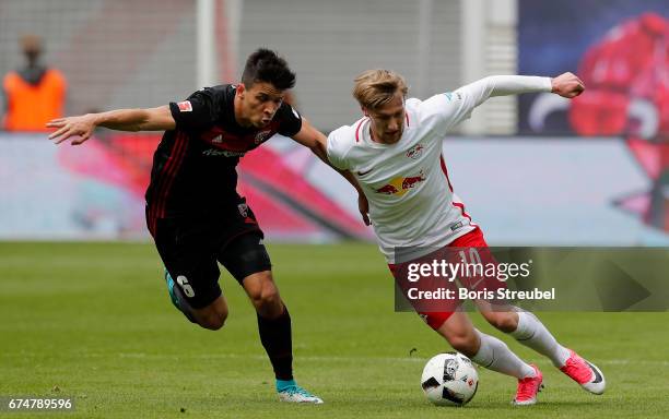 Emil Forsberg of RB Leipzig is challenged by Alfredo Morales of FC Ingolstadt 04 during the Bundesliga match between RB Leipzig and FC Ingolstadt 04...