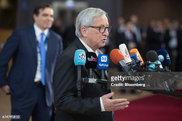 Jean-Claude Juncker, president of the European Commission, speaks to members of the media as he arrives for a European Union leaders emergency Brexit...