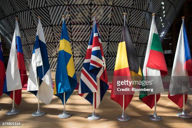 British Union flag, commonly known as the Union Jack, center, hangs in line with other national flags ahead of a European Union leaders emergency...