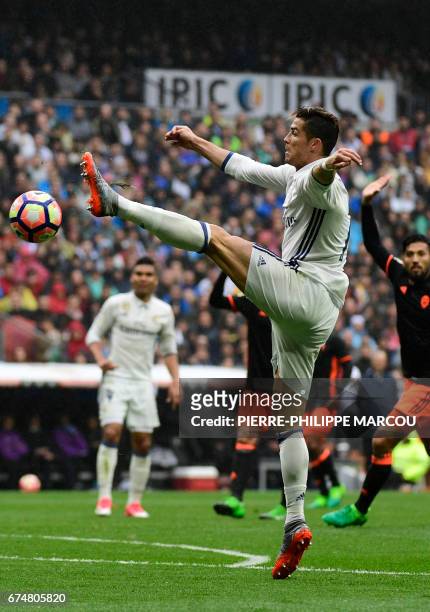 Real Madrid's Portuguese forward Cristiano Ronaldo tries to control the ball during the Spanish league football match Real Madrid CF vs Valencia CF...