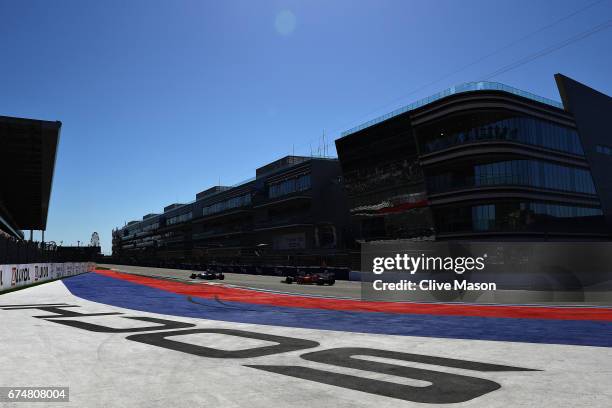 Sebastian Vettel of Germany driving the Scuderia Ferrari SF70H behind Lewis Hamilton of Great Britain driving the Mercedes AMG Petronas F1 Team...