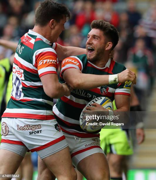 Owen Williams of Leicester celebrates with team mate Freddie Burns after scoring their third try during the Aviva Premiership match between Leicester...