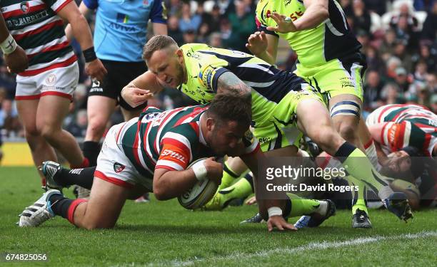 George McGuigan of Leicester dives over to score their fifth try during the Aviva Premiership match between Leicester Tigers and Sale Sharks at...