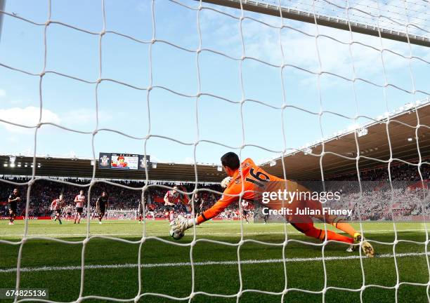 Eldin Jakupovic of Hull City saves a penalty from Dusan Tadic of Southampton during the Premier League match between Southampton and Hull City at St...