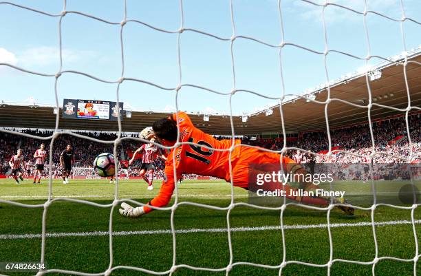 Eldin Jakupovic of Hull City saves a penalty from Dusan Tadic of Southampton during the Premier League match between Southampton and Hull City at St...