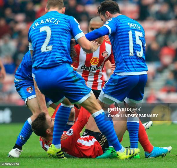 Sunderland's Italian striker Fabio Borini is confrunted by Bournemouth players after a challenge on Bournemouth's English midfielder Lewis Cook...