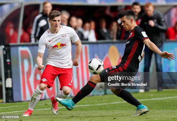 Marcel Sabitzer of RB Leipzig is challenged by Alfredo Morales of FC Ingolstadt 04 during the Bundesliga match between RB Leipzig and FC Ingolstadt...