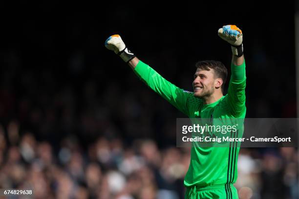 Fulham's Marcus Bettinelli celebrates at full time of the Sky Bet Championship match between Fulham and Brentford at Craven Cottage on April 29, 2017...