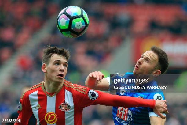 Sunderland's English-born Scottish defender Donald Love and Bournemouth's English midfielder Marc Pugh go for the ball during the English Premier...