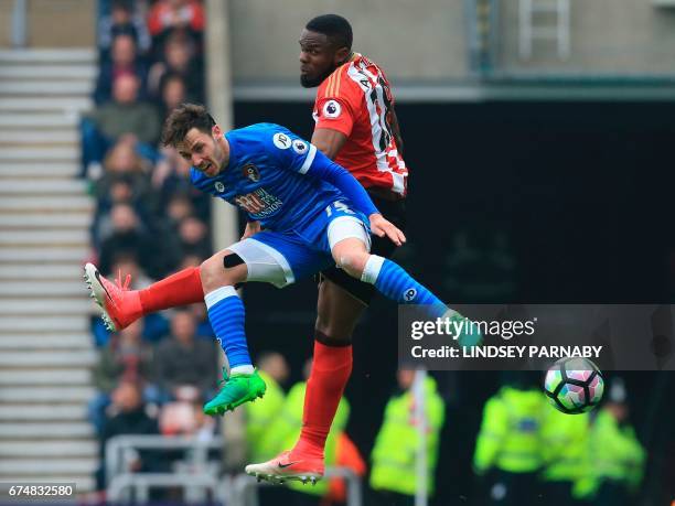 Sunderland's Nigerian striker Victor Anichebe challenges Bournemouth's English defender Adam Smith during the English Premier League football match...