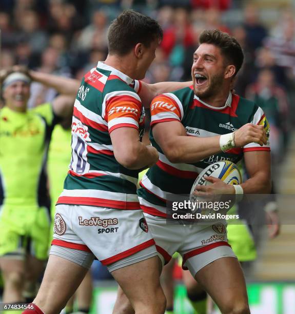 Owen Williams of Leicester celebrates with team mate Freddie Burns after scoring their third try during the Aviva Premiership match between Leicester...