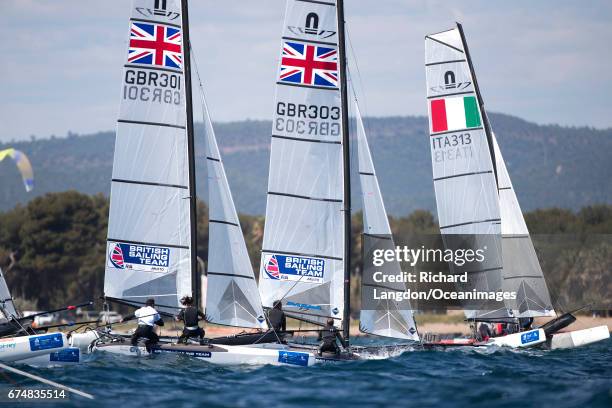 John Gimson and Anna Burnet and Tom Phipps and Nikki Boniface from the British Sailing Team sail their Nacra 17s during the ISAF Sailing World Cup...