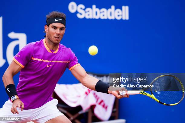 Rafael Nadal of Spain plays a forehand against Horacio Zeballos of Argentina in their semifinal match on day six of the Barcelona Open Banc Sabadell...