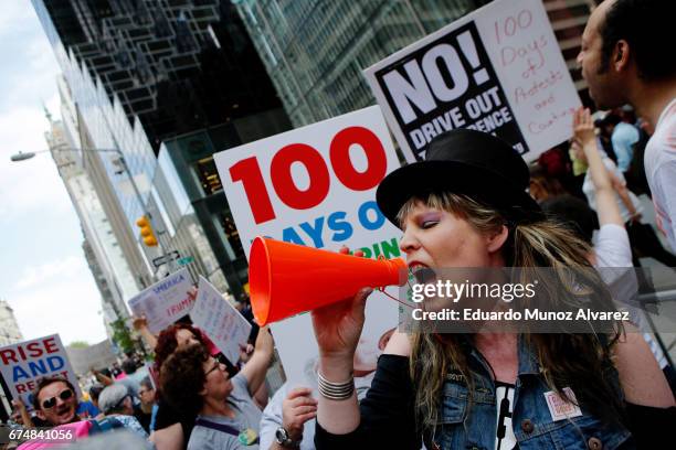 People shout slogans against US President Donald Trump at Trump Tower on April 29, 2017 in New York City. Activists are protesting against Trump on...