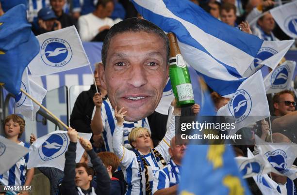 Brighton fans hold a cardboard cut-out of Chris Hughton, manager of Brighton and Hove Albion during the Sky Bet Championship match between Brighton &...