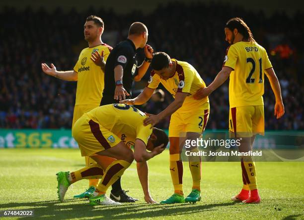 James Tarkowski of Burnley is hit by an object during the Premier League match between Crystal Palace and Burnley at Selhurst Park on April 29, 2017...