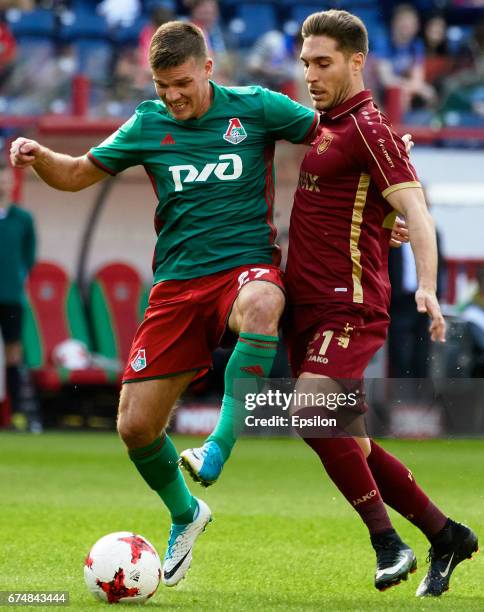 Igor Denisov of FC Lokomotiv Moscow challenged by Ruben Rochina of FC Rubin Kazan during the Russian Premier League match between FC Lokomotiv Moscow...