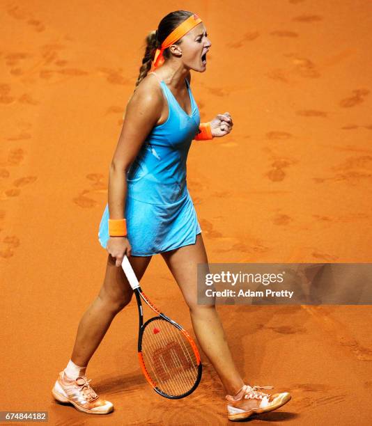 Kristina Mladenovic of France celebrates winning a set in her match against Maria Sharapova of Russia during the Porsche Tennis Grand Prix at Porsche...