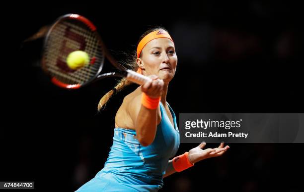 Kristina Mladenovic of France plays a forehand in her match against Maria Sharapova of Russia during the Porsche Tennis Grand Prix at Porsche Arena...