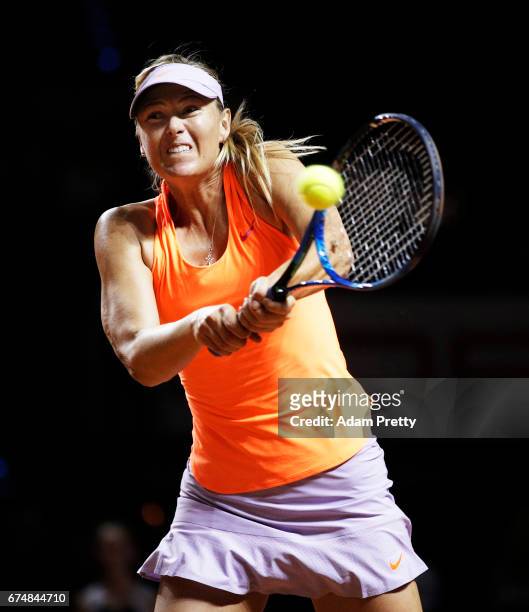 Maria Sharapova of Russia plays a backhand during her match against Kristina Mladenovic of France during the Porsche Tennis Grand Prix at Porsche...