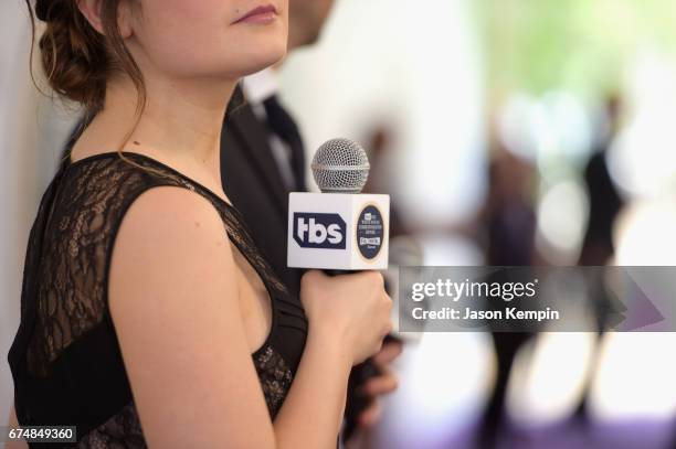 Closeup of Amy Hoggart holding her microphone on the carpet during Full Frontal With Samantha Bee's Not The White House Correspondents' Dinner at DAR...