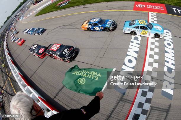 Daniel Hemric, driver of the Blue Gate Bank Chevrolet, and Kyle Benjamin, driver of the ToyotaCare Toyota, lead the field to green during the NASCAR...