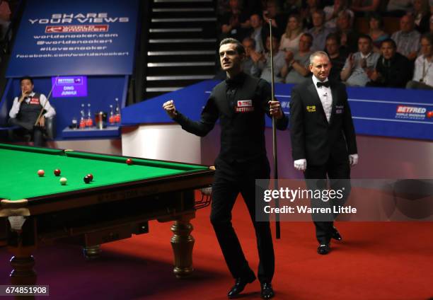 Mark Selby of England celebrates winning his semi-final match against Ding Junhui of China on day fifteen of Betfred World Championship 2017 at...