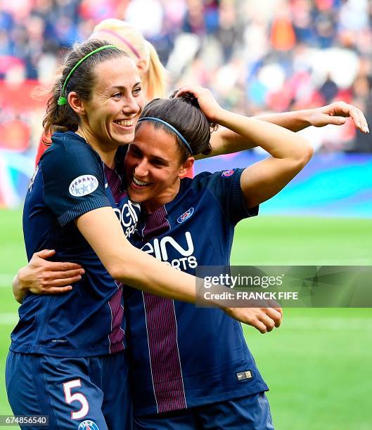 Paris Saint-Germain's French defender Sabrina Delannoy and Paris Saint-Germain's spanish midfielder Veronica Boquete celebrate their victory at the...