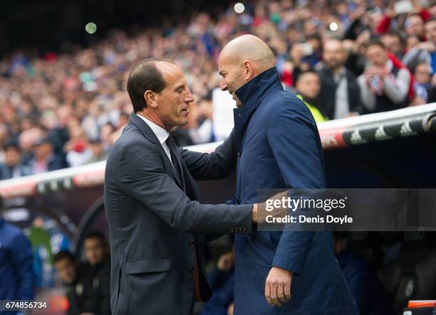 Real Madrid manager Zinedine Zidane greets manager Salvador Gonzalez Marco VoroÕ of Valencia CF before the start of the La Liga match between Real...
