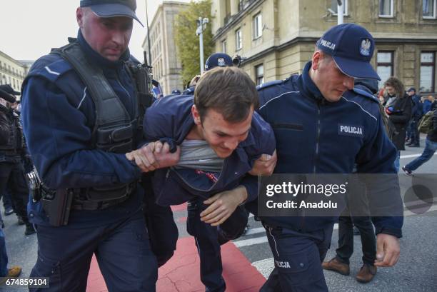 Police take some protesters into custody during a protest against the nationalist Far Right march that staged within 83rd anniversary of the ONR in...