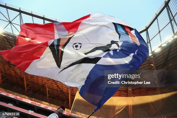 Lyon fan waves his flag during the UEFA Women's Champions League Semi Final second leg match between Olympique Lyon and Manchester City at the Stade...