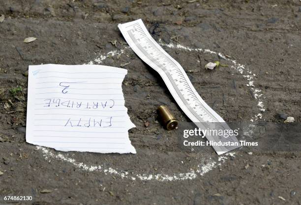 Delhi Police officer and forensic experts collect the samples outside Rohini court on April 29, 2017 in New Delhi, India. Rajesh, a notorious...