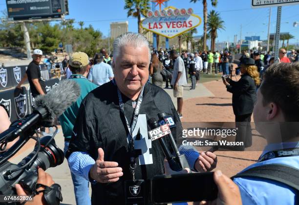 Clark County Commissioner Steve Sisolak is interviewed during the Oakland Raiders 2017 NFL Draft event at the Welcome to Fabulous Las Vegas sign on...