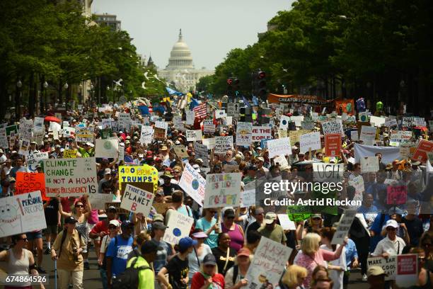 People march from the U.S. Capitol to the White House for the People's Climate Movement to protest President Donald Trump's enviromental policies...