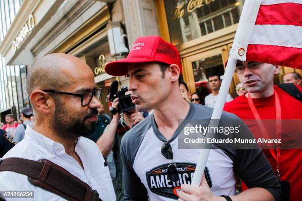 Trump supporter confronts activists as people take part in the '100 Days of Failure' protest on April 29, 2017 in New York City. Activists are...